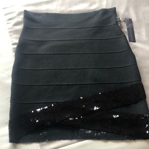 Elegant knit skirt. Poof Couture black sequins